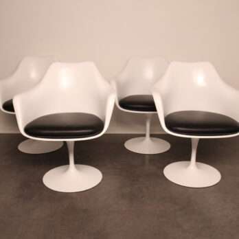 Stylish white chairs with black cushions